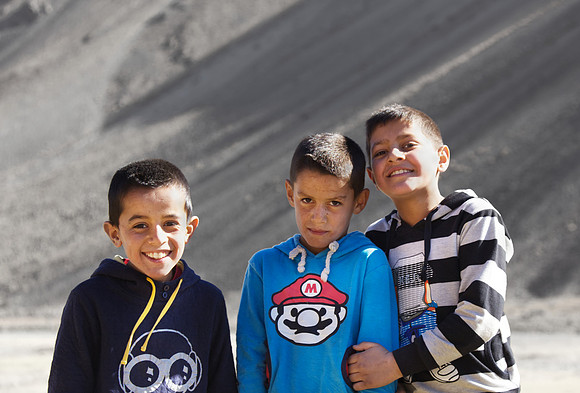 Three Afghan boys - this study will highlight an open, friendly curiosity toward foreigners